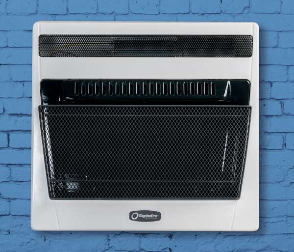 A blue brick workshop wall with a wall-mounted SignitePro vent-free heater.